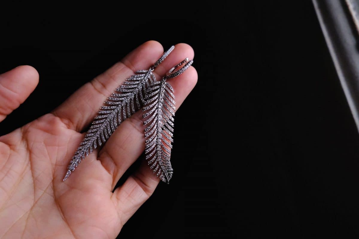 Diamond feather earrings deals