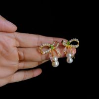 bow pearl drop earrings, ribbon earrings with pearl, pearl drop earrings singapore, ribbon stud earrings gold, bow pearl earrings gold, double pearl drop earrings, peanut pearl earrings, pearl earrings singapore, Gem gardener